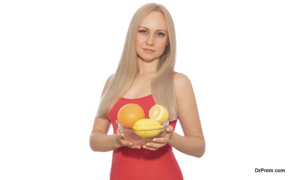 Blonde model in red with plate of fruits
