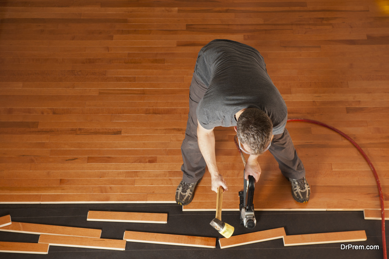 installing planks of hardwood floor