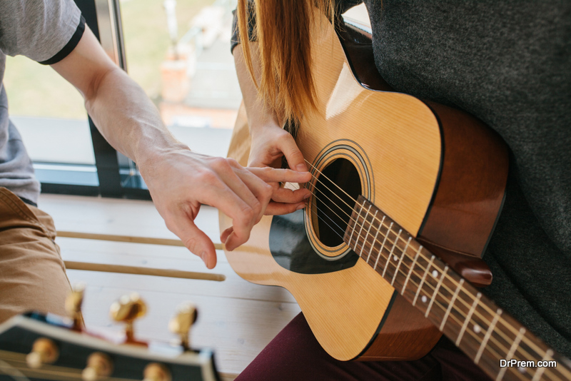 Learning to play the guitar. 